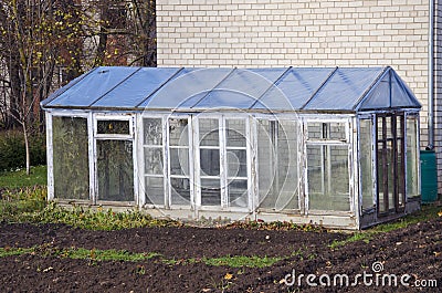 Greenhouse construction in autumn time garden Stock Photo