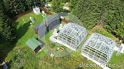 Science station greenhouse drone aerial open top chambers climate change research Bily Kriz, plant spruce Picea abies Stock Photo
