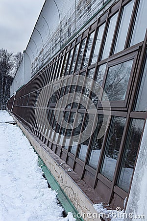 greenhouse windows facing the street in winter Stock Photo