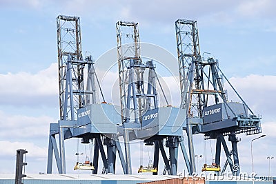 Greenock, Inverclyde / Scotland - 04/16/2019: Clydeport carrier cranes for transportation lifting of containers and freight onto s Editorial Stock Photo