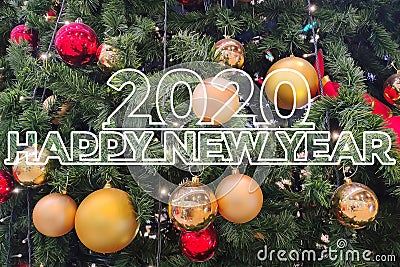 Greeting card with the inscription `Happy New Year 2020` on the background of a decorated Christmas tree Stock Photo