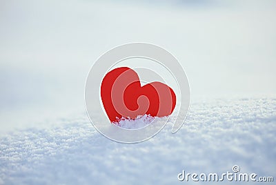 Greeting card with lonely heart on the dazzling blue snow Stock Photo