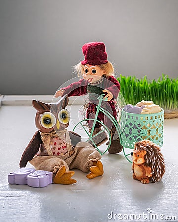 Greeting card on the topic of hygiene. A toy in a suit of a hare on a bicycle delivers soap to children Stock Photo