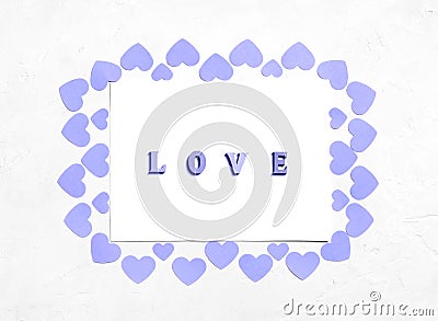 Greeting card for Valentine`s Day with violet hearts and the inscription love. Color of the year 2022 Very Peri. Valentines day Stock Photo