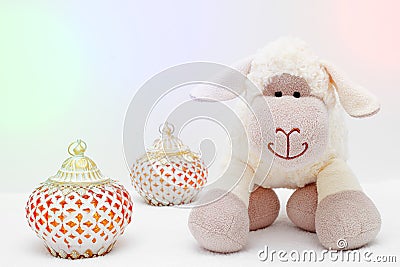 Greeting card on white background. Eid Al Adha sacrifice festival, Islamic Arabic candle and sheep Stock Photo