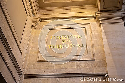 Greffe du tribunal text on ancient wall facade building means in french court registry Stock Photo