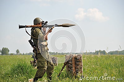 A grenade launcher warrior at the shooting range is preparing to fire a shot Editorial Stock Photo