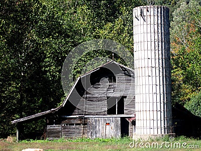 Grey barn with silo Stock Photo