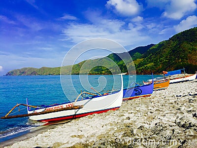 Grey beach and the four boats Stock Photo