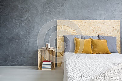 Grey bedroom with OSB bed Stock Photo