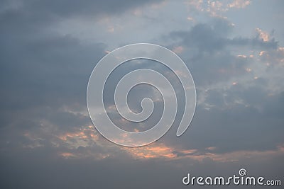 A grey and blue pastel coloured clouded sunset sky Stock Photo