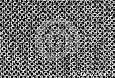 Grey breathable porous poriferous material for air ventilation with holes. Black and white Sportswear nylon texture Stock Photo