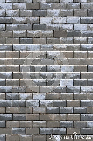 Grey bright dark brown wet weathered decorative abstract brick wall vertical Stock Photo