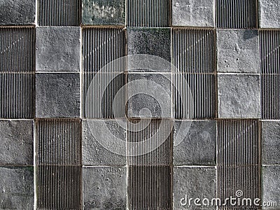 Grey concrete wall with geometric square pattern and distressed textures Stock Photo