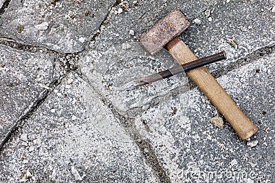 Grey flagstones with stone mason tools Stock Photo