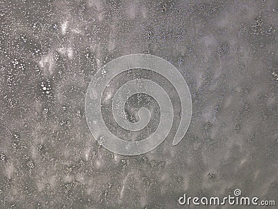 Grey foam on a windshield Stock Photo
