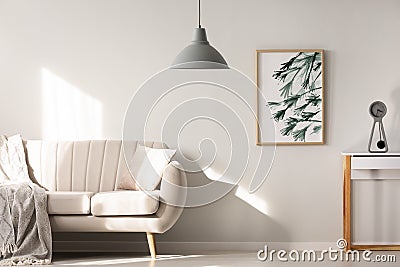 Grey lamp in bright living room interior with poster next to bei Stock Photo