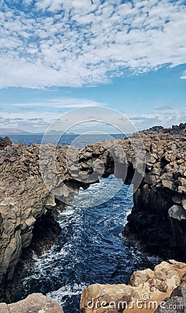 A lava arch in lanzarote Stock Photo