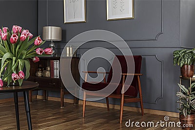 Grey living room interior with wainscoting on the wall, wooden c Stock Photo