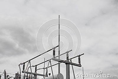 Grey metal power structure against a cloudy sky Stock Photo