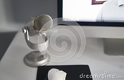 Grey microphone in a white table Stock Photo