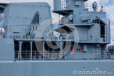 Grey navy battleship in a port in summertime Stock Photo
