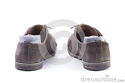 Grey ocks and brown suede shoes. Stock Photo