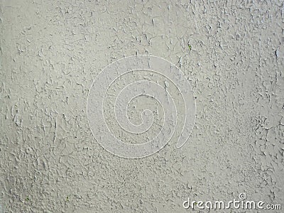 Grey paint peeling on a metallic surface background. Old grungy, weathered painted wall texture. Cracked, dirty, silver plaster Stock Photo