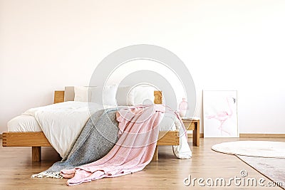 Blankets thrown on bed Stock Photo