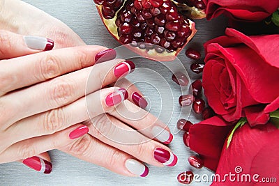 Grey, pink and red asymmetry nail art manicure Stock Photo
