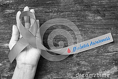 Grey ribbon with red blood drop for diabetic eye disease awareness month and for World diabetes day Stock Photo