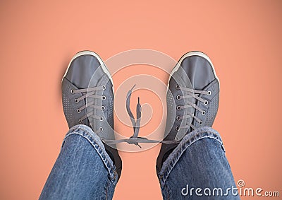 Grey shoes on feet with pink background Stock Photo