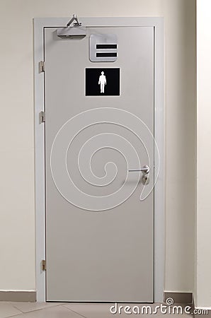 Grey toilet doors for male genders Stock Photo