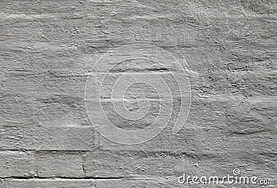 Grey wall, texture, background. The building wall, painted with whiting. Wavy and bumpy surface. Gray brick wall Stock Photo