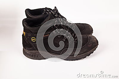 Greyder black hiking shoes and a white background, Sturdy hiking boots Editorial Stock Photo