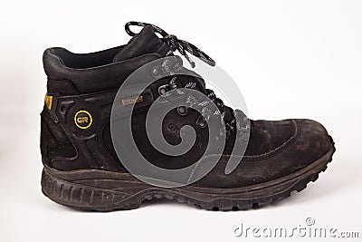 Greyder black hiking shoes and a white background, Sturdy hiking boots Editorial Stock Photo