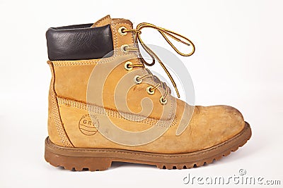 Greyder brown hiking shoes and a white background, Sturdy hiking boots Editorial Stock Photo