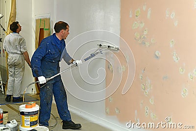 Painters apply the primer coat Editorial Stock Photo