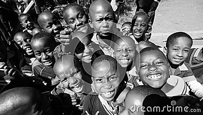 Greyscale shot of African Primary School Children on their lunch break Editorial Stock Photo