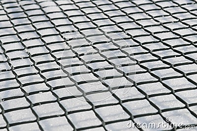 A grid beeing down on the snow. Stock Photo