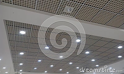 Grid ceiling and gypsum ceiling make an nice architectural interior false ceiling view or design for an commercial building such Stock Photo