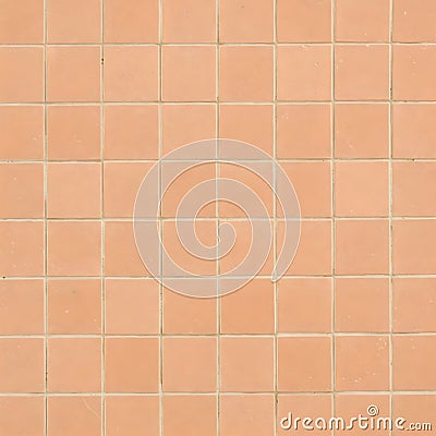 A grid of square, peach-colored ceramic tiles forms a simple, repeating background pattern Stock Photo