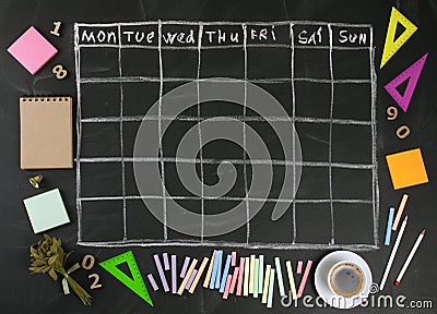 Grid timetable schedule with stationery on black chalkboard back Stock Photo