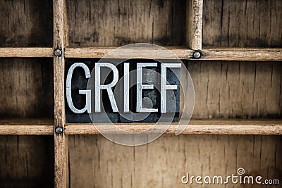 Grief Concept Metal Letterpress Word in Drawer Stock Photo