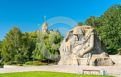 The Grieving Mother sculpture and a church on the Mamayev Kurgan in Volgograd, Russia Editorial Stock Photo