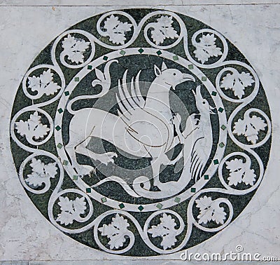 Griffin mythical animal in a decorative circle on the Chiesa dei Santi Giovanni e Reparata Stock Photo