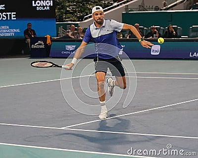 Grigor Dimitrov of Bulgaria in action during quarter-final match against Carlos Alcaraz of Spain at 2024 Miami Open Editorial Stock Photo