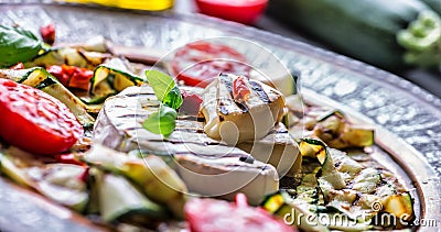 Grill Brie camembert cheese zucchini with chili pepper and olive oil. Italian mediterranean or greek cuisine. Stock Photo