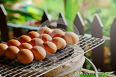 Grill egg stick on grille is organic Thai tradition steed food in local market Stock Photo