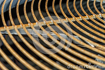 Grill of the fan of heavy duty central air conditioner system and running fan in the background Stock Photo